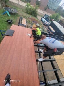 Aaron and Sascha installing Nexan aluminum decking.