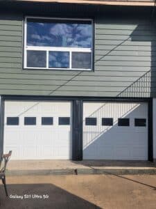 Garage door capping with diamond pleats and a stacked vinyl window in the second floor office.