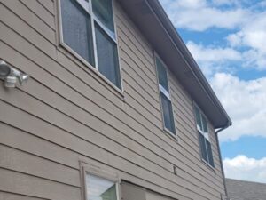 Picture of exterior siding with bad seams, failing caulking and improper installation