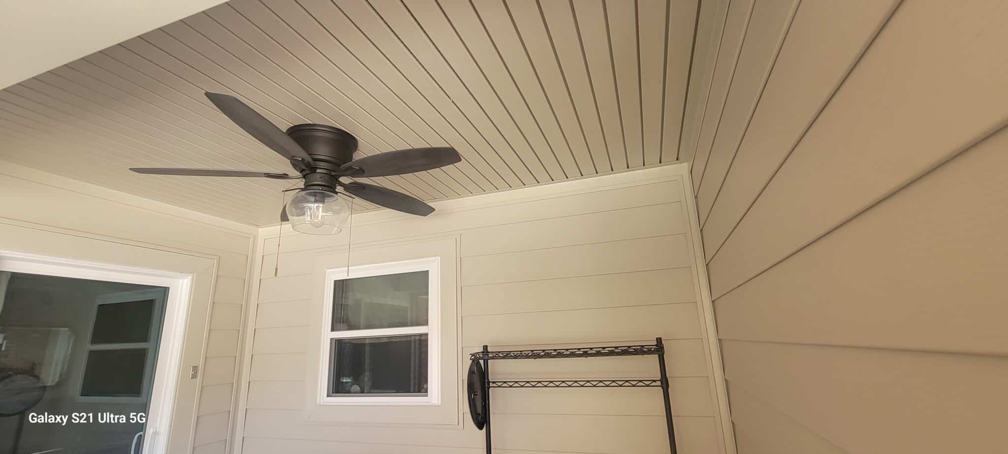 Ascend composite siding on a back porch with matching soffit, fascia and aluminum capping