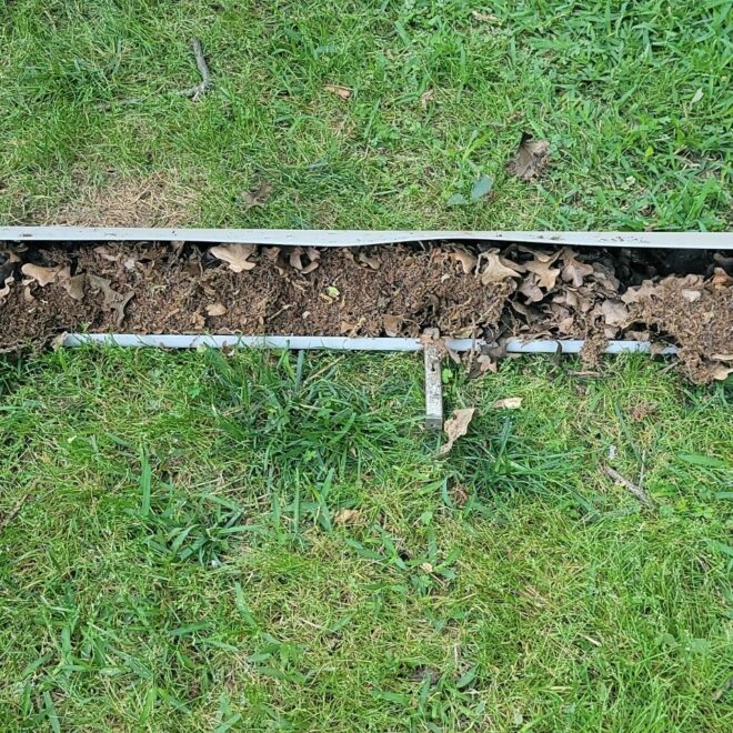 This is what your gutters look like when you neglect them and they will damage your home. These are completely blocked from years of debris build-up and lack of proper maintenance.